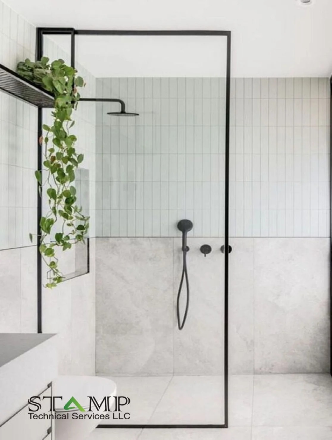 Narrow grey bathroom with louvered cabinet and wall-hung WC