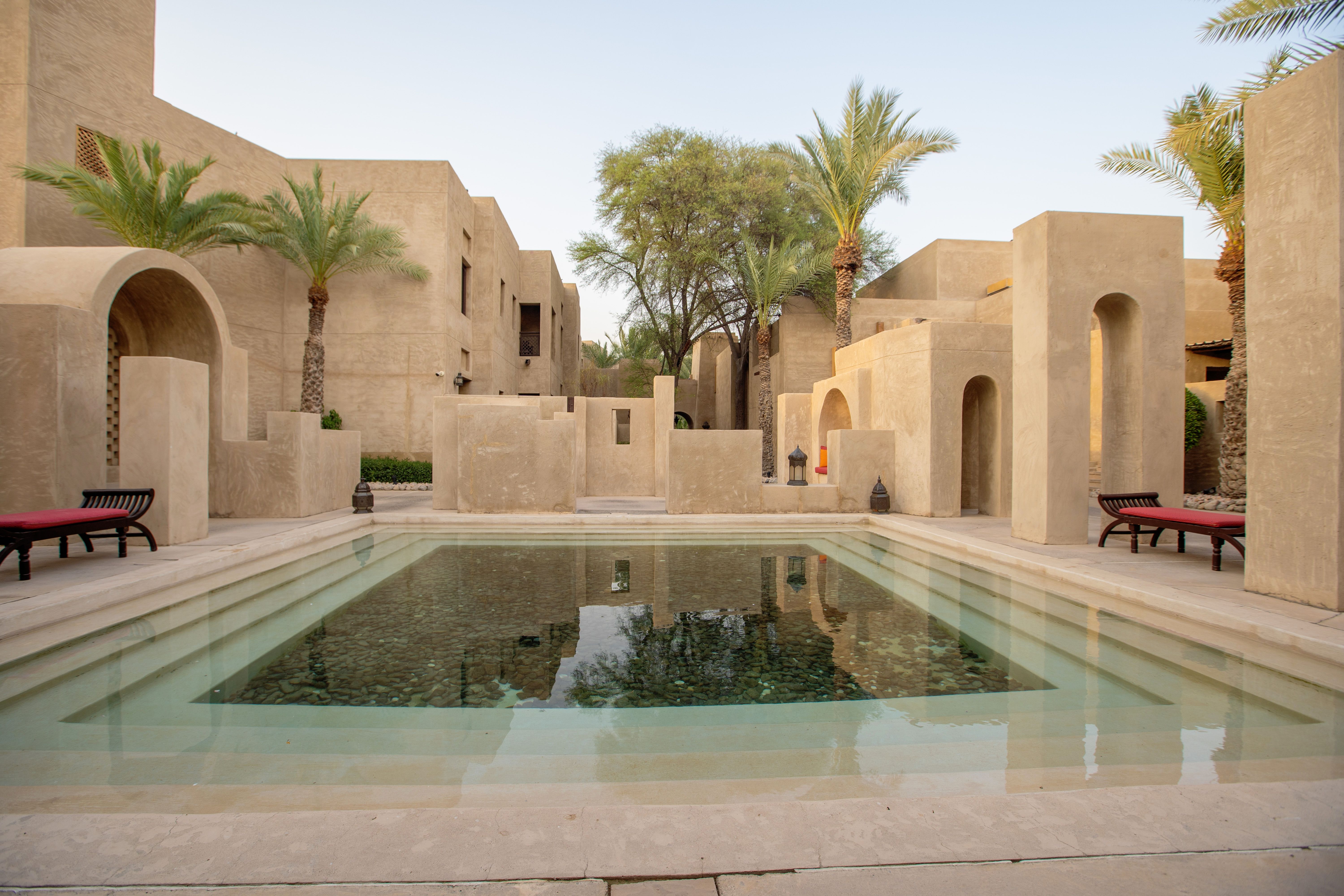 Aerial view of villa with pool and garden landscaping in Dubai