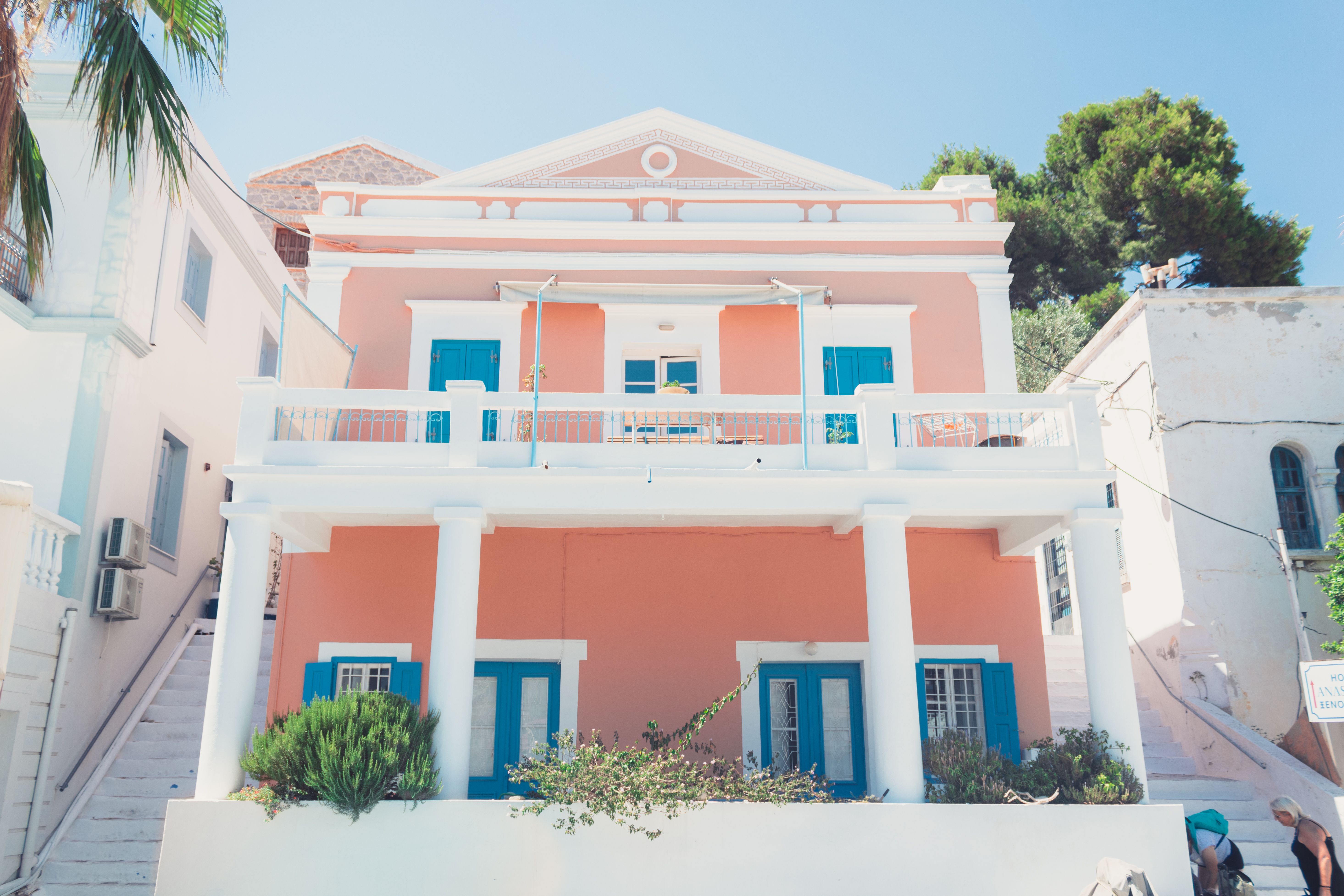 White villa exterior with arches and flowering shrubs in Dubai